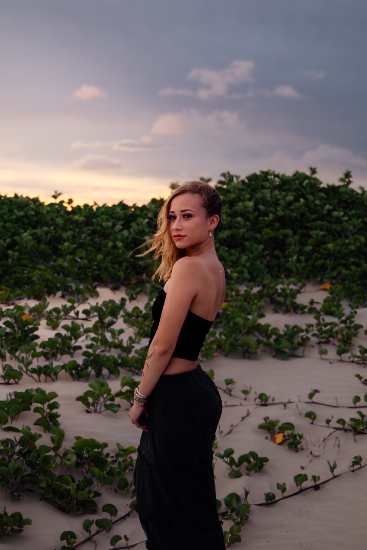Senior portrait among coastal greenery