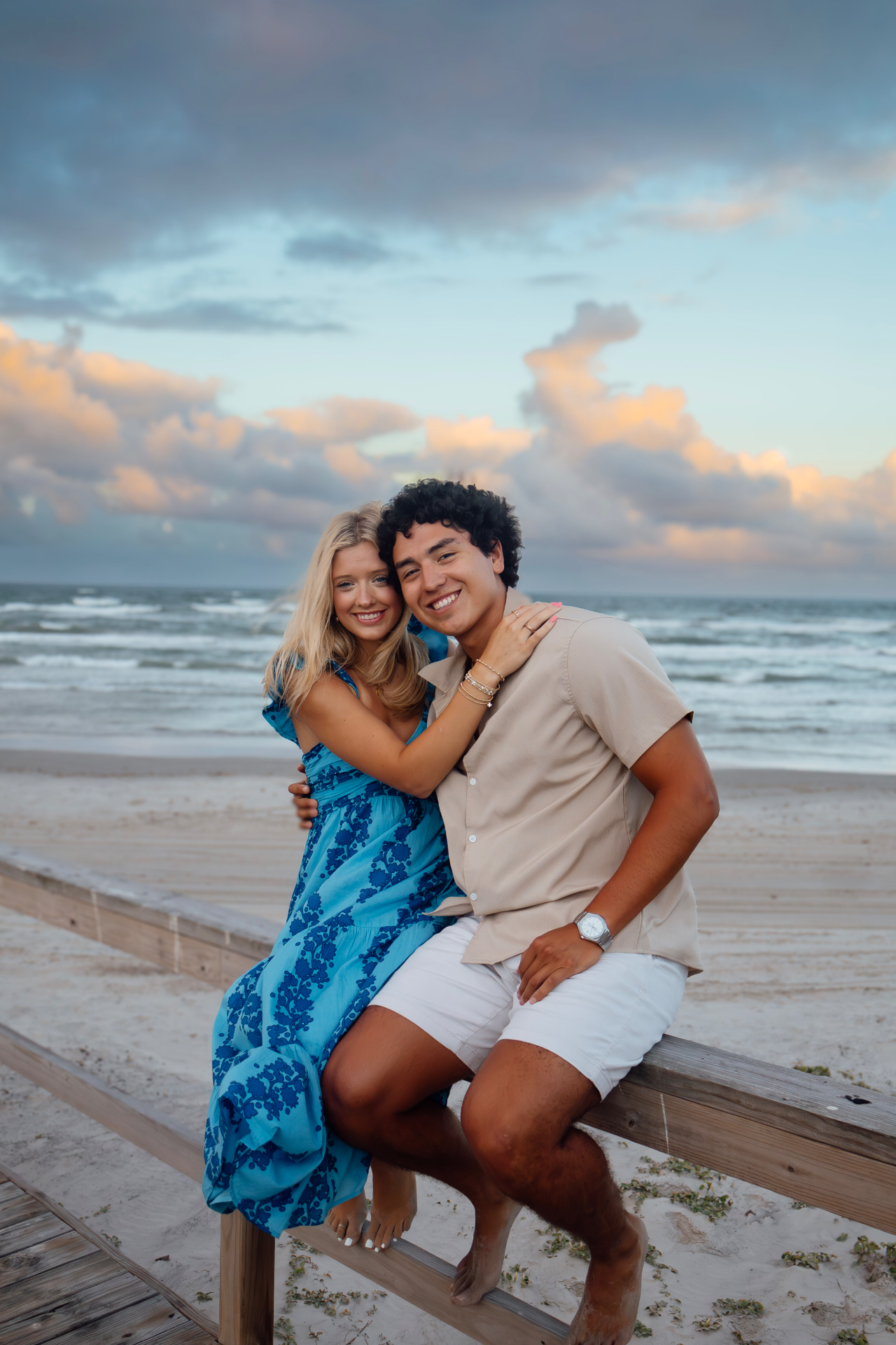 Couple sitting together on the boardwalk