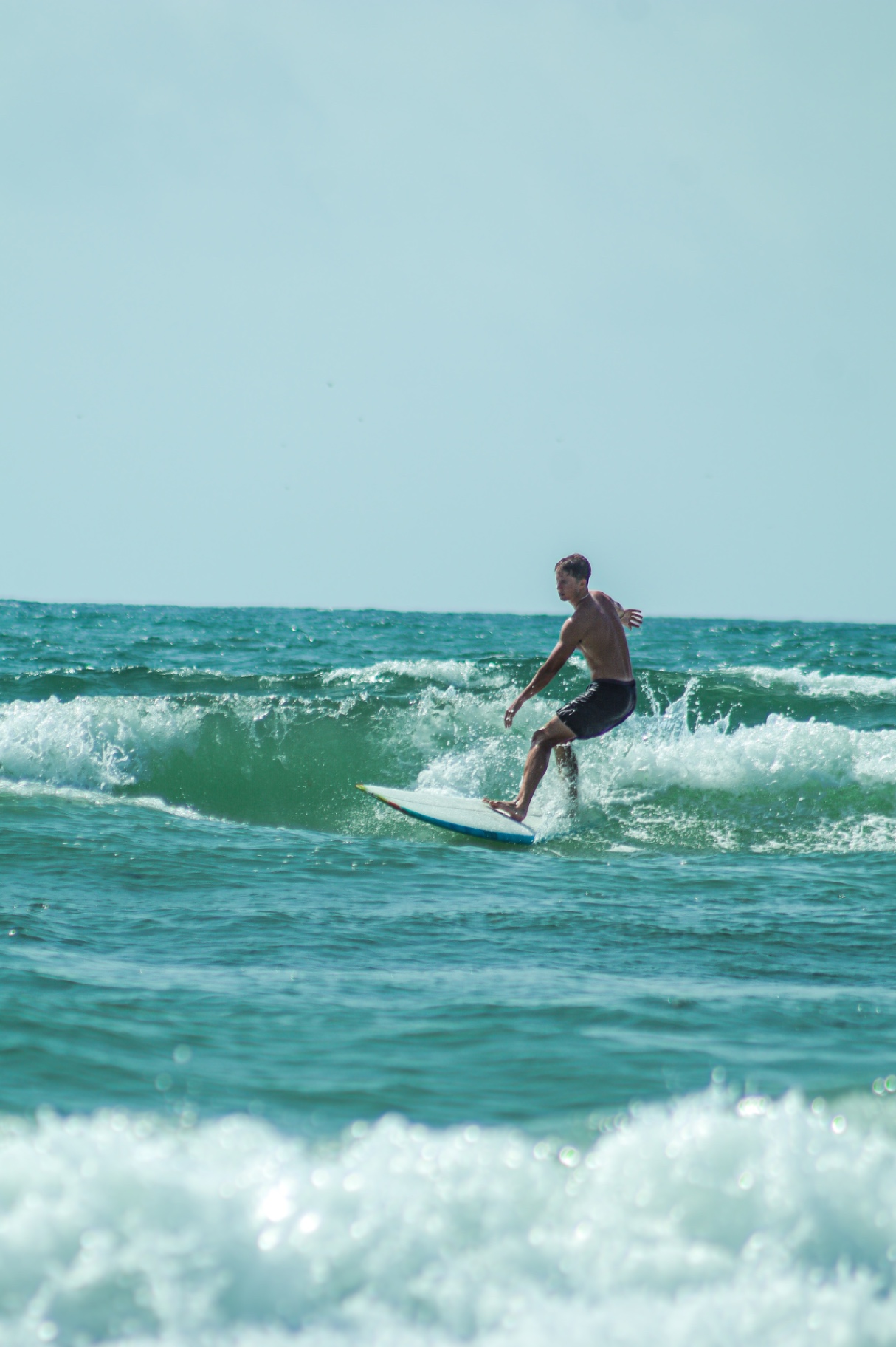 Surfer trimming a small wave